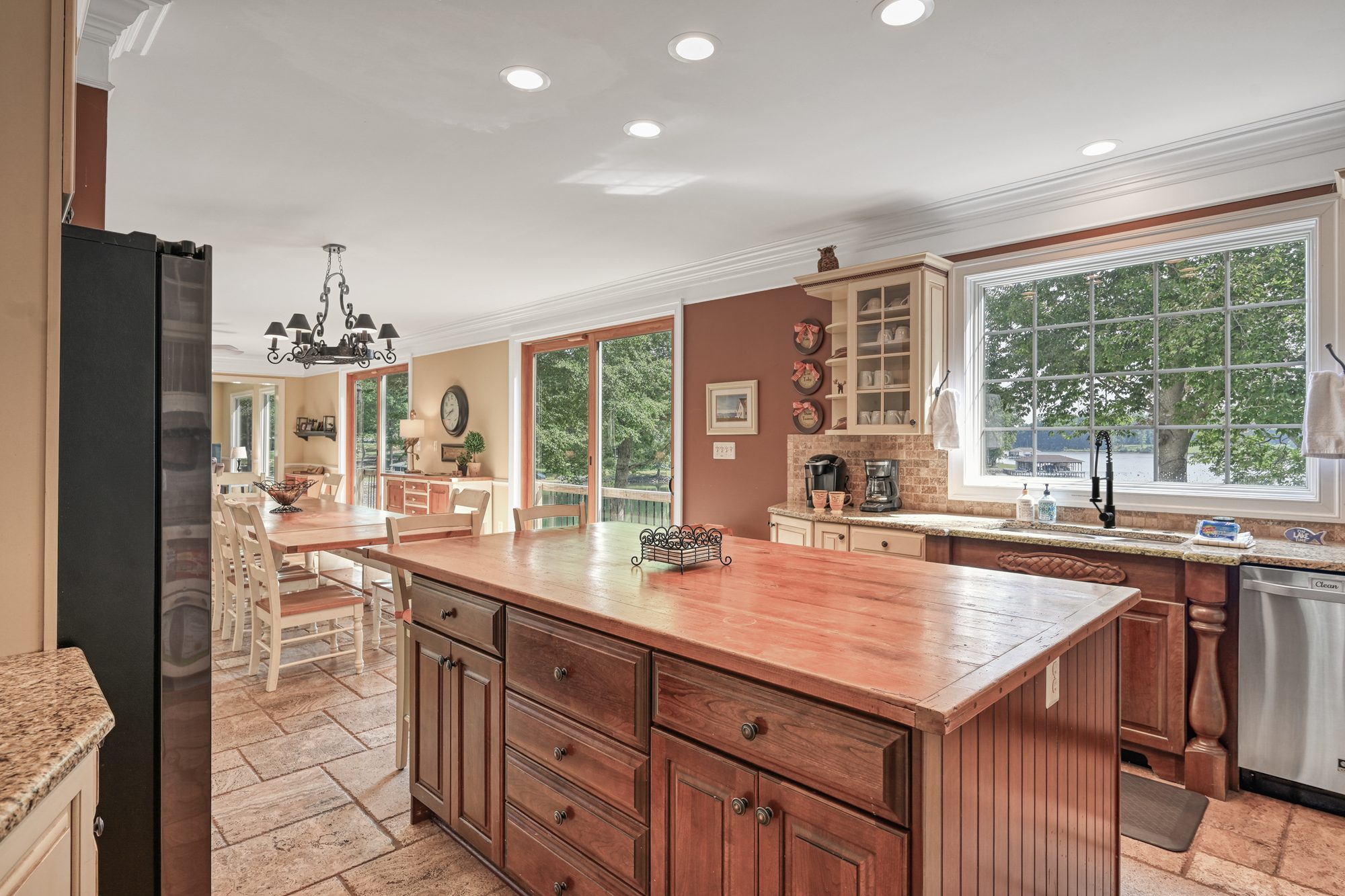 Main level kitchen with wood island and window over the sink